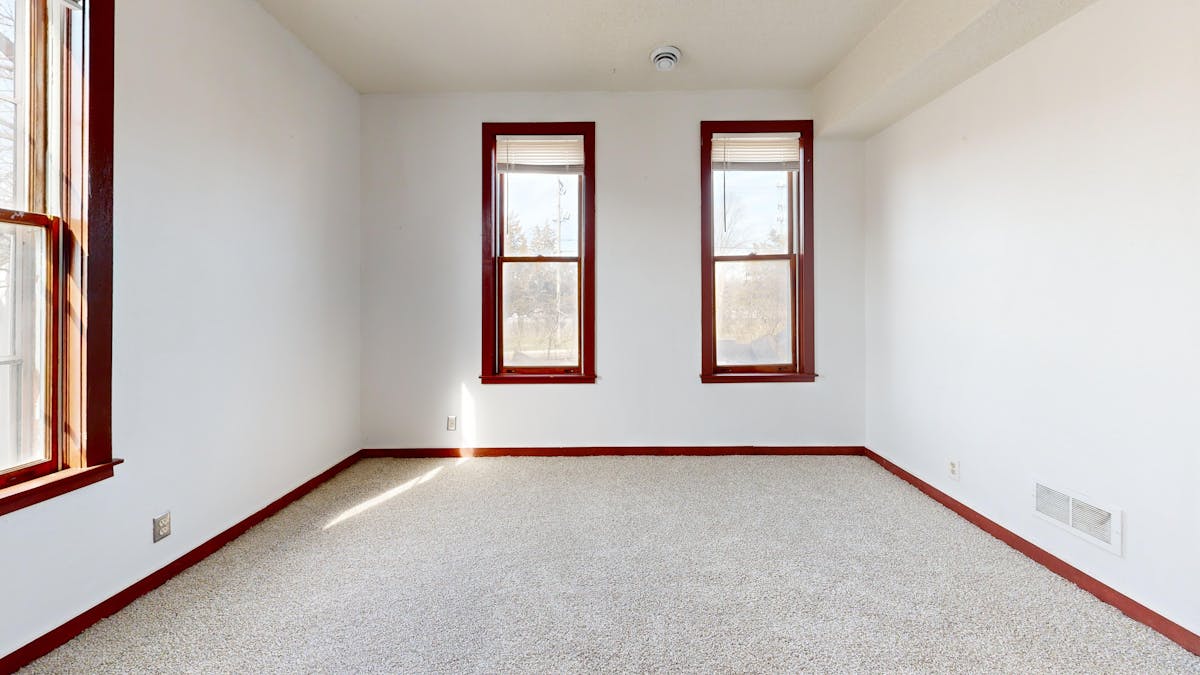 Bright empty living room in a new home ready for move-in cleaning